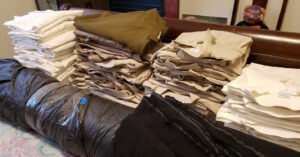 stacks of folded linen shirts
