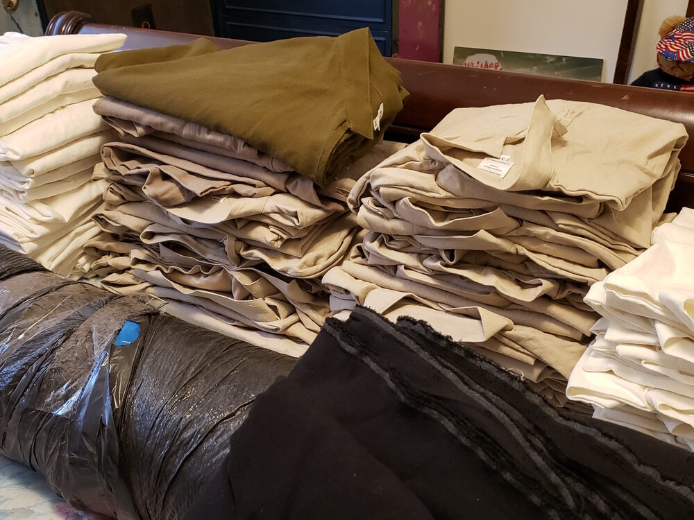 stacks of folded linen shirts
